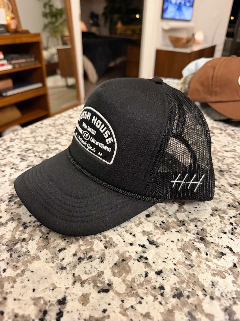 Huega House Black Trucker Cap with White Patch and Stitch Detail